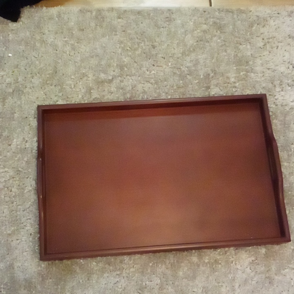 Wooden serving tray. Never used just decor. Handles on sides easier to carry.